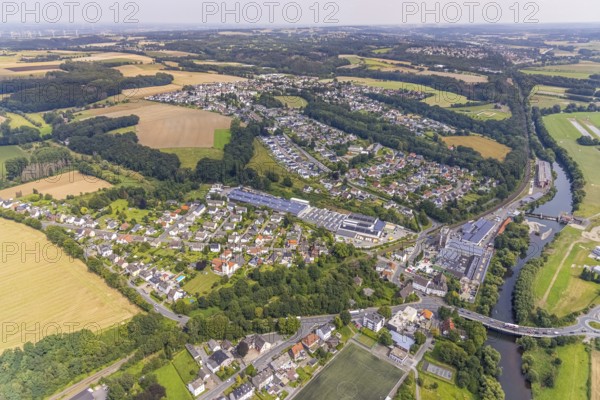 Aerial view, Schürenfeld planned industrial area at the federal road B233 Unnaer Straße in the district Dellwig, view to the district Langschede and Ardey in Fröndenberg/Ruhr, Ruhr area, North Rhine-Westphalia, Germany, car repair shop, DE, Europe, Fröndenberg/Ruhr, commercial enterprises, commercial area, commercial area, commercial site, commercial use, industrial area, industrial building, industrial site, landscape conservation area, aerial view, aerial photography, aerial photography, Menden, nature reserve, nature reserve Strickherdicker Bachtal, overview, bird's-eye view, birds-eyes view, overview