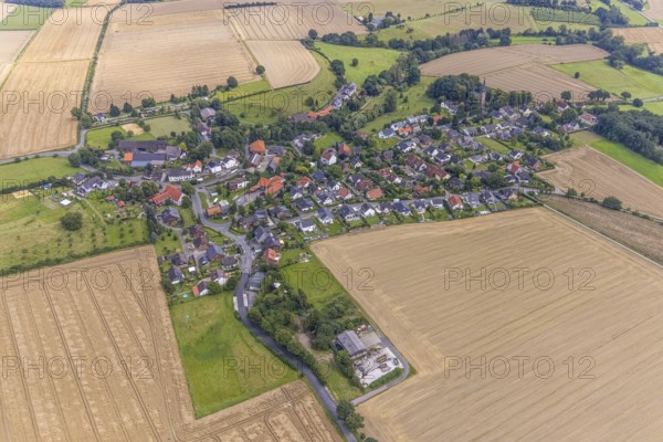 Aerial view, village view with protestant village church at the cemetery and catholic church St. Agnes in the south in the district Bausenhagen, Fröndenberg/Ruhr, Ruhr area, North Rhine-Westphalia, Germany, place of worship, burial place, DE, Europe, cemetery, memorial, religious community, place of worship, house of God, graves, burial ground, holy place, church, parish, denomination, aerial view, aerial photography, aerial photography, religion, religious site, resting place, overview, bird's eye view, birds-eyes view, overview