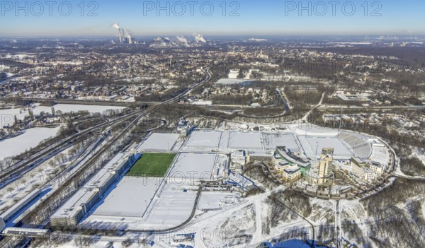 Aerial view, training ground and park stadium in the snow at the Veltins-Arena, Hotel Courtyard by Marriott Gelsenkirchen, construction site at the hotel, Parkallee, Stadionring, Erle, Gelsenkirchen, Ruhr area, North Rhine-Westphalia, Germany, Berger Feld, DE, Europe, FC Schalke 04, distant view, football pitch, football stadium, football club, gastronomy, hotel, hotel facilities, hotel business, aerial view, aerial photography, aerial photography, snow, sports, sports facilities, sports field, sports facility, training grounds, overview, accommodation, bird's eye view, winter, birds-eyes view, overview