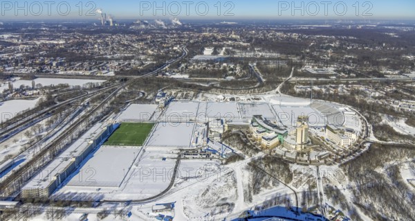 Aerial view, training ground and park stadium in the snow at the Veltins-Arena, Hotel Courtyard by Marriott Gelsenkirchen, construction site at the hotel, Parkallee, Stadionring, Erle, Gelsenkirchen, Ruhr area, North Rhine-Westphalia, Germany, Berger Feld, DE, Europe, FC Schalke 04, distant view, football pitch, football stadium, football club, gastronomy, hotel, hotel facilities, hotel business, aerial view, aerial photography, aerial photography, snow, sports, sports facilities, sports field, sports facility, training grounds, overview, accommodation, bird's eye view, winter, birds-eyes view, overview
