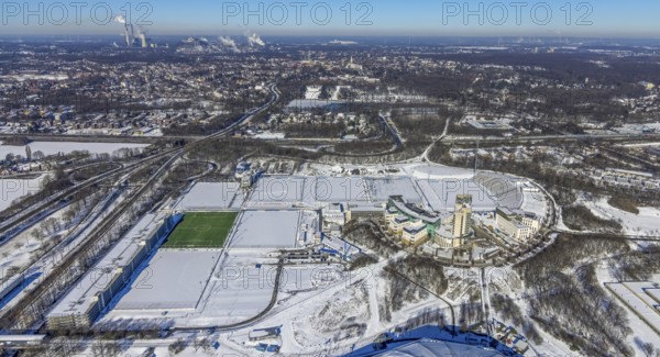 Aerial view, training ground and park stadium in the snow at the Veltins-Arena, Hotel Courtyard by Marriott Gelsenkirchen, construction site at the hotel, Parkallee, Stadionring, Erle, Gelsenkirchen, Ruhr area, North Rhine-Westphalia, Germany, Berger Feld, DE, Europe, FC Schalke 04, distant view, football pitch, football stadium, football club, gastronomy, hotel, hotel facilities, hotel business, aerial view, aerial photography, aerial photography, snow, sports, sports facilities, sports field, sports facility, training grounds, overview, accommodation, bird's eye view, winter, birds-eyes view, overview