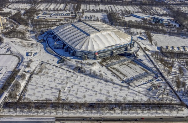 Aerial view, Schalke Veltins-Arena with closed roof and extension area for grass, Rudi-Assauer-Platz, Beckhausen, Gelsenkirchen, Ruhr area, North Rhine-Westphalia, Germany, Arena, Arena AufSchalke, Berger Feld, Bundesliga stadium, DE, Europe, FC Schalke 04, football pitch, football stadium, football club, aerial view, aerial photography, aerial photography, snow, sports, sports facilities, sports ground, sports venue, stadium, overview, bird's eye view, winter, birds-eyes view, closed roof of the arena, overview