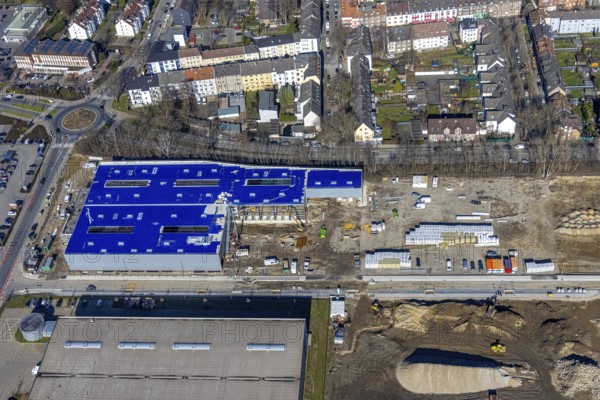 Aerial view, construction site industrial estate and service location Europastraße, former blast furnace site Schalker Verein, Gelsenkirchen-Bulmke-Hüllen, Gelsenkirchen, Ruhr area, North Rhine-Westphalia, Germany, construction work, building, construction area, building site, building plots, construction measure, construction project, construction site, DE, Europe, commercial enterprises, commercial area, commercial area, commercial park, commercial site, commercial use, industrial area, industrial building, industrial site, roundabout, roundabout, logistics, logistics service, logistics service provider, logistics provider, logistics centre, aerial view, aerial photography, aerial photography, new building, overview, bird's-eye view, overview