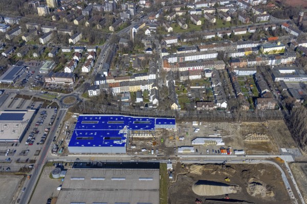 Aerial view, construction site industrial estate and service location Europastraße, former blast furnace site Schalker Verein, Gelsenkirchen-Bulmke-Hüllen, Gelsenkirchen, Ruhr area, North Rhine-Westphalia, Germany, construction work, building, construction area, building site, building plots, construction measure, construction project, construction site, DE, Europe, commercial enterprises, commercial area, commercial area, commercial park, commercial site, commercial use, industrial area, industrial building, industrial site, roundabout, roundabout, logistics, logistics service, logistics service provider, logistics provider, logistics centre, aerial view, aerial photography, aerial photography, new building, overview, bird's-eye view, overview