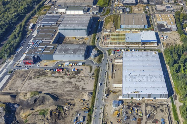 Aerial view, construction site commercial area and industrial park Schalker Verein on Europastrasse with Wheels Logistic, bilstein group logistics centre, ProReServ, new construction DFI, WDP_VIB logistics hall in the Bulmke-Hüllen district in Gelsenkirchen, Ruhr area, North Rhine-Westphalia, Germany, construction work, construction, construction area, building site, building plots, construction measure, construction project, construction site, DE, Europe, Gelsenkirchen, commercial enterprises, commercial area, commercial park, commercial location, commercial use, industrial area, industrial building, industrial location, logistics, logistics service, logistics service provider, logistics provider, logistics centre, aerial photograph, aerial photography, aerial photography, new building, overview, bird's-eye view, birds-eyes view, former blast furnace location Schalker Verein, overview