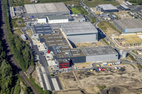 Aerial view, construction site commercial area and industrial park Schalker Verein on Europastrasse with bilstein group logistics centre in the Bulmke-Hüllen district in Gelsenkirchen, Ruhr area, North Rhine-Westphalia, Germany, construction work, building, construction area, building site, building plots, construction project, construction site, DE, Europe, Gelsenkirchen, commercial enterprises, commercial area, commercial area, commercial park, commercial site, commercial use, industrial area, industrial building, industrial site, logistics, logistics service, logistics service provider, logistics provider, logistics centre, aerial view, aerial photography, aerial photography, new construction, overview, bird's-eye view, former blast furnace site Schalker Verein, overview
