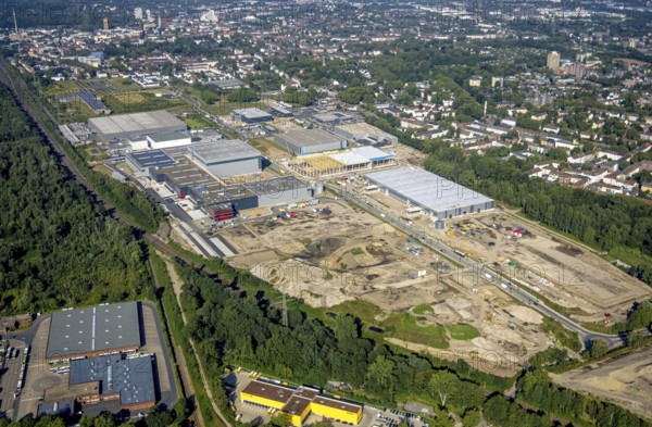 Aerial view, construction site commercial area and industrial park Schalker Verein on Europastrasse with Wheels Logistic, bilstein group logistics centre, ProReServ, new construction DFI, WDP_VIB logistics hall in the Bulmke-Hüllen district in Gelsenkirchen, Ruhr area, North Rhine-Westphalia, Germany, construction work, construction, construction area, building site, building plots, construction measure, construction project, construction site, DE, Europe, Gelsenkirchen, commercial enterprises, commercial area, commercial park, commercial location, commercial use, industrial area, industrial building, industrial location, logistics, logistics service, logistics service provider, logistics provider, logistics centre, aerial photograph, aerial photography, aerial photography, new building, overview, bird's-eye view, birds-eyes view, former blast furnace location Schalker Verein, overview