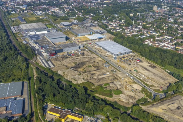 Aerial view, construction site commercial area and industrial park Schalker Verein on Europastrasse with Wheels Logistic, bilstein group logistics centre, ProReServ, new construction DFI, WDP_VIB logistics hall in the Bulmke-Hüllen district in Gelsenkirchen, Ruhr area, North Rhine-Westphalia, Germany, construction work, construction, construction area, building site, building plots, construction measure, construction project, construction site, DE, Europe, Gelsenkirchen, commercial enterprises, commercial area, commercial park, commercial location, commercial use, industrial area, industrial building, industrial location, logistics, logistics service, logistics service provider, logistics provider, logistics centre, aerial photograph, aerial photography, aerial photography, new building, overview, bird's-eye view, birds-eyes view, former blast furnace location Schalker Verein, overview