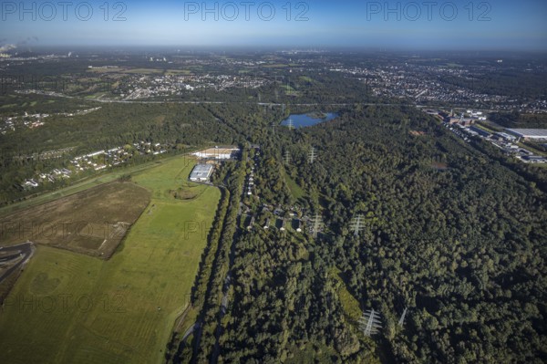 Aerial view, Resser Mark city forest with Münsterstrasse in the Resser Mark district of Gelsenkirchen, Ruhr area, North Rhine-Westphalia, Germany, DE, Emscherbruch, Europe, Ewaldsee, Gelsenkirchen, aerial view, aerial photography, aerial photography, nature reserve, nature reserve Emscherbruch, overview, bird's eye view, forest, birds-eyes view, overview