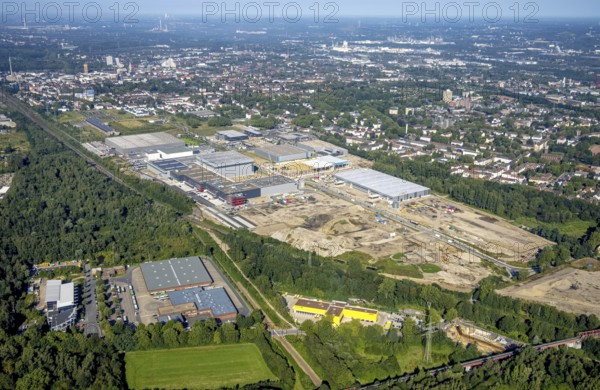 Aerial view, construction site commercial area and industrial park Schalker Verein on Europastrasse with Wheels Logistic, bilstein group logistics centre, ProReServ, new construction DFI, WDP_VIB logistics hall in the Bulmke-Hüllen district in Gelsenkirchen, Ruhr area, North Rhine-Westphalia, Germany, construction work, construction, construction area, building site, building plots, construction measure, construction project, construction site, DE, Europe, Gelsenkirchen, commercial enterprises, commercial area, commercial park, commercial location, commercial use, industrial area, industrial building, industrial location, logistics, logistics service, logistics service provider, logistics provider, logistics centre, aerial photograph, aerial photography, aerial photography, new building, overview, bird's-eye view, birds-eyes view, former blast furnace location Schalker Verein, overview