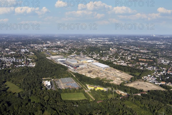 Aerial view, construction site commercial area and industrial park Schalker Verein on Europastrasse with Wheels Logistic, bilstein group logistics centre, ProReServ, new construction DFI, WDP_VIB logistics hall in the Bulmke-Hüllen district in Gelsenkirchen, Ruhr area, North Rhine-Westphalia, Germany, construction work, construction, construction area, building site, building plots, construction measure, construction project, construction site, DE, Europe, Gelsenkirchen, commercial enterprises, commercial area, commercial park, commercial location, commercial use, industrial area, industrial building, industrial location, logistics, logistics service, logistics service provider, logistics provider, logistics centre, aerial photograph, aerial photography, aerial photography, new building, overview, bird's-eye view, birds-eyes view, former blast furnace location Schalker Verein, overview