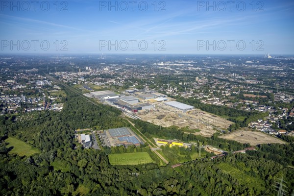Aerial view, construction site commercial area and industrial park Schalker Verein on Europastrasse with Wheels Logistic, bilstein group logistics centre, ProReServ, new construction DFI, WDP_VIB logistics hall in the Bulmke-Hüllen district in Gelsenkirchen, Ruhr area, North Rhine-Westphalia, Germany, construction work, construction, construction area, building site, building plots, construction measure, construction project, construction site, DE, Europe, Gelsenkirchen, commercial enterprises, commercial area, commercial park, commercial location, commercial use, industrial area, industrial building, industrial location, logistics, logistics service, logistics service provider, logistics provider, logistics centre, aerial photograph, aerial photography, aerial photography, new building, overview, bird's-eye view, birds-eyes view, former blast furnace location Schalker Verein, overview