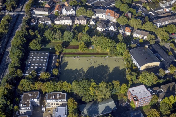 Aerial view, indoor swimming pool and sports hall as well as youths on the sports field at the Leibniz-Gymnasium in the district of Buer in Gelsenkirchen, Ruhr area, North Rhine-Westphalia, Germany, bathing establishment, bathing resort, DE, Europe, Gelsenkirchen, indoor swimming pool, aerial view, aerial photography, aerial photography, sports facilities, sports hall, sports field, sports facility, overview, bird's-eye view, overview