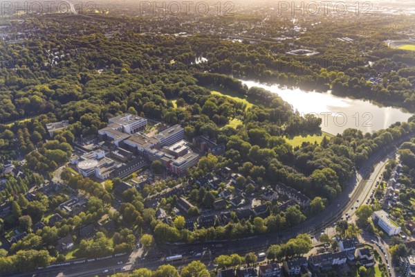 Aerial view, Bergmannsheil and Rehabilitation Clinic at Berger See in the Buer district of Gelsenkirchen, Ruhr area, North Rhine-Westphalia, Germany, DE, Europe, Gelsenkirchen, healthcare, hospital, helipad, clinic, clinic centre, hospital, aerial photograph, aerial photography, aerial photography, medical facility, medical aid, lake, overview, bird's-eye view, overview, medical care