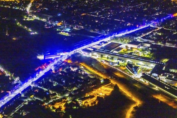 Aerial view, lighting in Schalke blue, Schalke 04, Kurt-Schumacher Straße with thyssenkrupp Electrical Steel GmbH, Schalke, Gelsenkirchen, Ruhr area, North Rhine-Westphalia, Germany, DE, twilight photography, Europe, commercial enterprises, commercial area, commercial park, commercial location, commercial use, industrial area, industrial site, light pollution, aerial view, aerial photography, aerial photography, night, night photography, night flight, overview, bird's-eye view, illuminated streets, birds-eyes view, blue band, blue light, artificial light, nightflight, overview