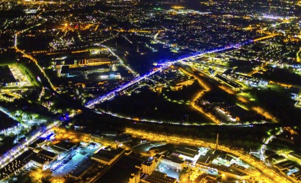 Aerial view, lighting in Schalke blue, Schalke 04, Kurt-Schumacher Straße with thyssenkrupp Electrical Steel GmbH, Schalke, Gelsenkirchen, Ruhr area, North Rhine-Westphalia, Germany, DE, twilight photography, Europe, commercial enterprises, commercial area, commercial park, commercial location, commercial use, industrial area, industrial site, light pollution, aerial view, aerial photography, aerial photography, night, night photography, night flight, overview, bird's-eye view, illuminated streets, birds-eyes view, blue band, blue light, artificial light, nightflight, overview