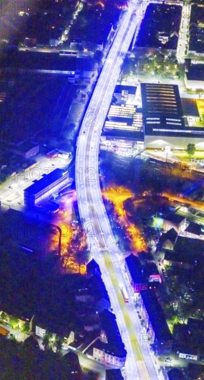 Aerial view, lighting in Schalke blue, Schalke 04, Kurt-Schumacher Straße with thyssenkrupp Electrical Steel GmbH, Schalke, Gelsenkirchen, Ruhr area, North Rhine-Westphalia, Germany, DE, twilight photography, Europe, commercial enterprises, commercial area, commercial park, commercial location, commercial use, industrial area, industrial site, light pollution, aerial view, aerial photography, aerial photography, night, night photography, night flight, overview, bird's-eye view, illuminated streets, birds-eyes view, blue band, blue light, artificial light, nightflight, overview