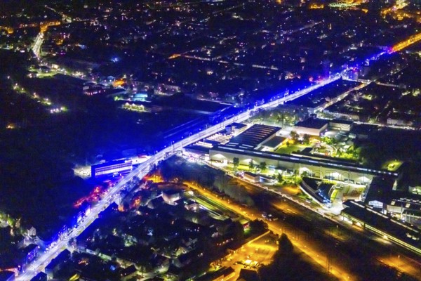 Aerial view, lighting in Schalke blue, Schalke 04, Kurt-Schumacher Straße with thyssenkrupp Electrical Steel GmbH, Schalke, Gelsenkirchen, Ruhr area, North Rhine-Westphalia, Germany, DE, twilight photography, Europe, commercial enterprises, commercial area, commercial park, commercial location, commercial use, industrial area, industrial site, light pollution, aerial view, aerial photography, aerial photography, night, night photography, night flight, overview, bird's-eye view, illuminated streets, birds-eyes view, blue band, blue light, artificial light, nightflight, overview
