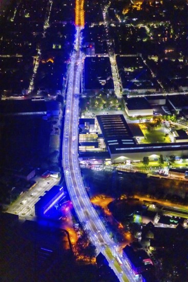 Aerial view, lighting in Schalke blue, Schalke 04, Kurt-Schumacher Straße with thyssenkrupp Electrical Steel GmbH, Schalke, Gelsenkirchen, Ruhr area, North Rhine-Westphalia, Germany, DE, twilight photography, Europe, commercial enterprises, commercial area, commercial park, commercial location, commercial use, industrial area, industrial site, light pollution, aerial view, aerial photography, aerial photography, night, night photography, night flight, overview, bird's-eye view, illuminated streets, birds-eyes view, blue band, blue light, artificial light, nightflight, overview