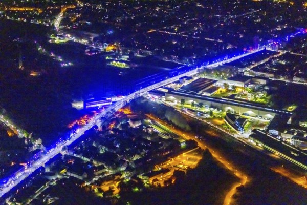 Aerial view, lighting in Schalke blue, Schalke 04, Kurt-Schumacher Straße with thyssenkrupp Electrical Steel GmbH, Schalke, Gelsenkirchen, Ruhr area, North Rhine-Westphalia, Germany, DE, twilight photography, Europe, commercial enterprises, commercial area, commercial park, commercial location, commercial use, industrial area, industrial site, light pollution, aerial view, aerial photography, aerial photography, night, night photography, night flight, overview, bird's-eye view, illuminated streets, birds-eyes view, blue band, blue light, artificial light, nightflight, overview