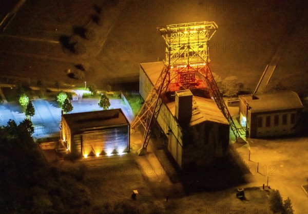 Aerial view, headframe shaft IX with engine houses in Consol Park, Bismarck, Gelsenkirchen, Ruhr area, North Rhine-Westphalia, Germany, Consol Yellow Art, DE, twilight photography, Europe, headframe, winding tower, light art installation, light pollution, aerial view, aerial photography, aerial photography, north engine house, south engine house, night, night shot, night flight, overview, bird's eye view, Consolidation colliery, illuminated streets, birds-eyes view, nightflight, overview