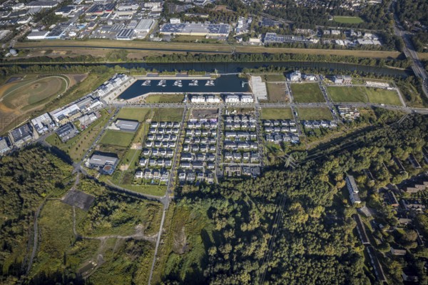 Aerial view, Graf Bismarck harbour with Stölting Marina and terraced house housing estate as well as construction site harbour quarter at the Rhine-Herne-Canal and river Emscher in the district Bismarck in Gelsenkirchen, Ruhr area, North Rhine-Westphalia, Germany, construction area, building site, building plots, building project, construction site, DE, Europe, Gelsenkirchen, property tax, harbour, harbour area, real estate, marina, aerial view, aerial photography, aerial photography, overview, bird's-eye view, residential complex, residential area, residential buildings, residential quality, residential quarter, housing estate, marina, birds-eyes view, overview