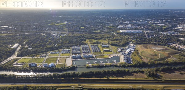 Aerial view, Graf Bismarck harbour with Stölting Marina and terraced house housing estate as well as construction site harbour quarter at the Rhine-Herne-Canal and river Emscher in the district Bismarck in Gelsenkirchen, Ruhr area, North Rhine-Westphalia, Germany, construction area, building site, building plots, building project, construction site, DE, Europe, Gelsenkirchen, property tax, harbour, harbour area, real estate, marina, aerial view, aerial photography, aerial photography, overview, bird's-eye view, residential complex, residential area, residential buildings, residential quality, residential quarter, housing estate, marina, birds-eyes view, overview