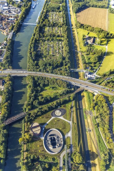 Aerial view, New pumping station building of the Emschergenossenschaft near the Sutumer Brücken on the lock island between the Rhine-Herne Canal and the river Emscher in the district of Schalke-Nord in Gelsenkirchen, Ruhr area, North Rhine-Westphalia, Germany, sewage pumping station, DE, Emschergenossenschaft, Emscher Island, Europe, Gelsenkirchen, community garden, allotment garden, allotment garden site, allotment garden site Bismarck-West, allotment garden association, aerial view, aerial photography, aerial photography, allotment garden, overview, bird's-eye view, birds-eyes view, overview