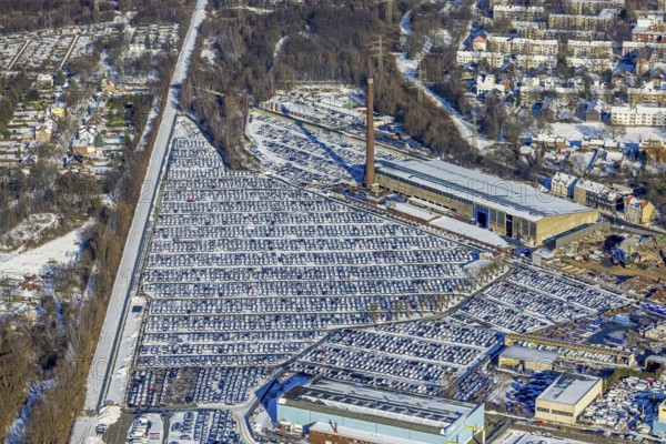 Aerial photo, CAT Automobillogistik Essen, Essen-Altenessen, Essen, Ruhr area, North Rhine-Westphalia, Germany, DE, Europe, shapes and colours, storage, logistics, logistics service, logistics service provider, logistics provider, aerial photo, aerial photography, aerial photography, snow, transport, transport service, overview, bird's eye view, winter, birds-eyes view, overview, car dump in winter, rows of cars, different coloured cars, car lot