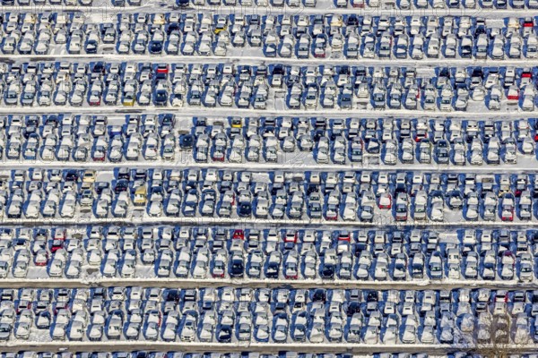 Aerial photo, CAT Automobillogistik Essen, Essen-Altenessen, Essen, Ruhr area, North Rhine-Westphalia, Germany, DE, Europe, shapes and colours, storage, logistics, logistics service, logistics service provider, logistics provider, aerial photo, aerial photography, aerial photography, snow, transport, transport service, overview, bird's eye view, winter, birds-eyes view, overview, car dump in winter, rows of cars, different coloured cars, car lot