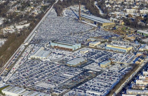 Aerial photo, CAT Automobillogistik Essen, Essen-Altenessen, Essen, Ruhr area, North Rhine-Westphalia, Germany, DE, Europe, shapes and colours, storage, logistics, logistics service, logistics service provider, logistics provider, aerial photo, aerial photography, aerial photography, snow, transport, transport service, overview, bird's eye view, winter, birds-eyes view, overview, car dump in winter, rows of cars, different coloured cars, car lot