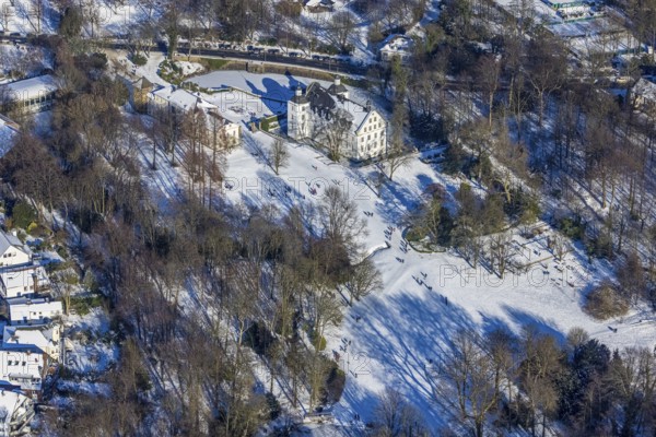 Aerial view, Borbeck Castle in winter landscape, Borbeck-Mitte, Essen, Ruhr area, North Rhine-Westphalia, Germany, DE, Europe, manor house, aerial view, aerial photography, aerial photography, park, castle, castle grounds, Schlossstraße, snow, overview, bird's-eye view, moated castle, winter, birds-eyes view, overview