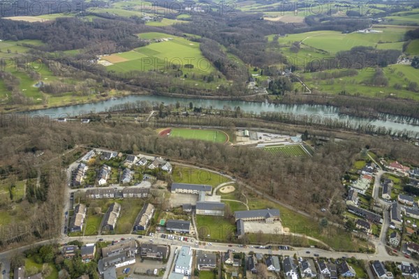 Aerial photo, Schmachtenbergschule, Kettwig Ruhrtalstraße sports ground on the Ruhr river with American football pitch, Schloss Oefte golf course, Essener Golf Club Haus Oefte e.V., Kettwig, Essen, Ruhr area, North Rhine-Westphalia, Germany, education, educational institution, DE, Europe, Fußball-Sport-Verein Kettwig e.V., football pitch, football stadium, football club, golf, golf course, golf club, golf course, golf meadow, teaching institute, aerial photography, aerial photography, aerial photography, school, sports, sports facilities, sports field, sports facility, stadium, overview, bird's-eye view, forest area, meadows and fields, birds-eyes view, overview