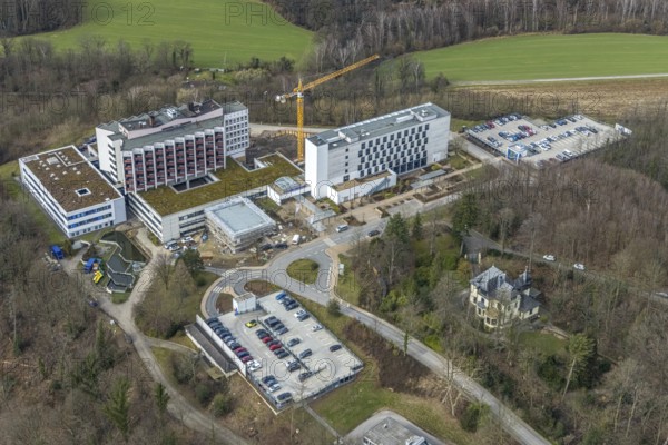 Aerial view, Ruhrlandklinik with construction site, Essen-Heidhausen, Essen, Ruhr area, North Rhine-Westphalia, Germany, construction work, construction area, construction site, building plots, construction project, construction site, DE, Europe, specialist clinic, healthcare, hospital, clinic, clinic centre, hospital, aerial view, aerial photography, aerial photography, medical facility, medical aid, new building, emergency service, Tüschener Weg, overview, bird's eye view, birds-eyes view, overview, medical care