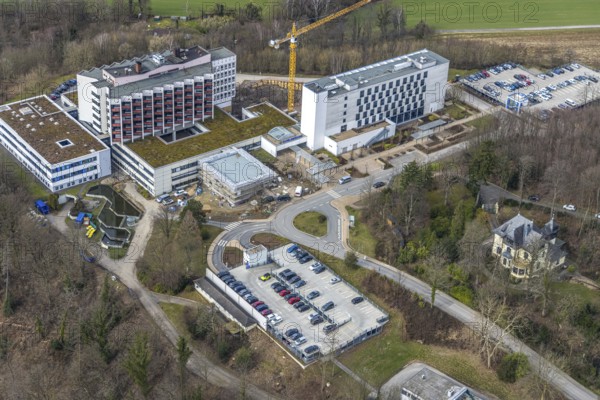 Aerial view, Ruhrlandklinik with construction site, Essen-Heidhausen, Essen, Ruhr area, North Rhine-Westphalia, Germany, construction work, construction area, construction site, building plots, construction project, construction site, DE, Europe, specialist clinic, healthcare, hospital, clinic, clinic centre, hospital, aerial view, aerial photography, aerial photography, medical facility, medical aid, new building, emergency service, Tüschener Weg, overview, bird's eye view, birds-eyes view, overview, medical care