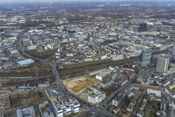 Aerial view, construction area for new literature quarter, demolition work former newspaper quarter, former WVW central editorial office and headquarters of the Funke Media Group, Südviertel, Essen, Ruhr area, North Rhine-Westphalia, Germany, expansion areas, construction work, construction, construction vehicles, construction area, construction site, construction crane, construction measure, construction project, construction site, Bert-Brecht-Straße, DE, renewal, development, Europe, Friedrichstrasse, gastronomy, commercial buildings, hotel, capacity requirements, aerial view, aerial photography, aerial photography, new construction, Sachsenstrasse, overview, enlarged bird's-eye view, becoming and growing, residential complex, living and living, residential area, residential buildings, residential neighbourhood, housing shortage, birds-eyes view, new offices, new flats, new hotel, overview