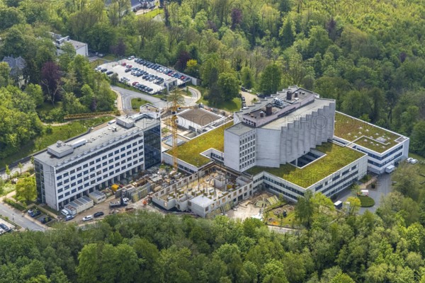 Aerial view, Ruhrlandklinik with construction site, Essen-Heidhausen, Essen, Ruhr area, North Rhine-Westphalia, Germany, construction work, construction area, construction site, building plots, construction crane, construction measure, construction project, construction site, DE, Europe, specialist clinic, healthcare, hospital, clinic, clinic centre, hospital, aerial photograph, aerial photography, aerial photography, medical facility, medical aid, new building, emergency service, Tüschener Weg, overview, bird's eye view, birds-eyes view, overview, medical care