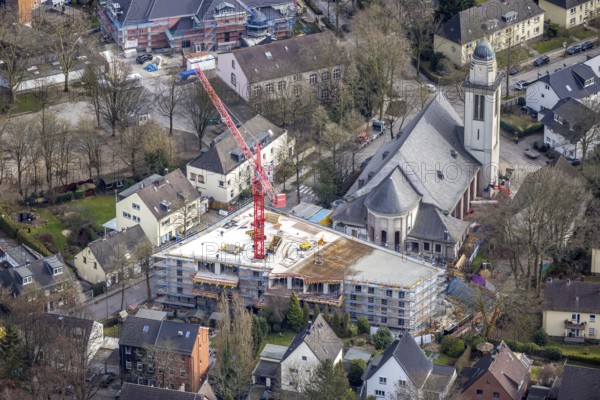 Aerial view, conversion of St. Mary's Church into flats and new construction for flats, Essen-Steele, Essen, Ruhr area, North Rhine-Westphalia, Germany, construction work, construction, construction area, building site, building plots, construction crane, construction project, construction site, Buschstraße, DE, Europe, property tax, real estate, church, aerial view, aerial photography, aerial photography, new construction, overview, bird's eye view, living and living, residential buildings, quality of living, residential neighbourhood, living space, birds-eyes view, overview