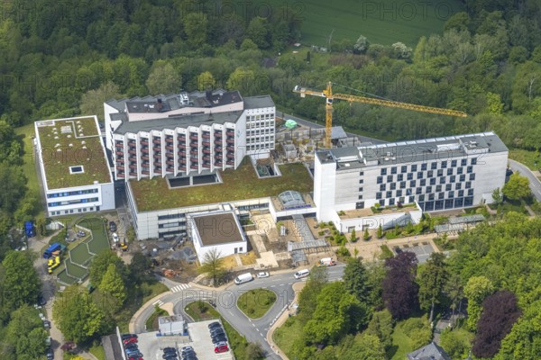 Aerial view, Ruhrlandklinik with construction site, Essen-Heidhausen, Essen, Ruhr area, North Rhine-Westphalia, Germany, construction work, construction area, construction site, building plots, construction crane, construction measure, construction project, construction site, DE, Europe, specialist clinic, healthcare, hospital, clinic, clinic centre, hospital, aerial photograph, aerial photography, aerial photography, medical facility, medical aid, new building, emergency service, Tüschener Weg, overview, bird's eye view, birds-eyes view, overview, medical care