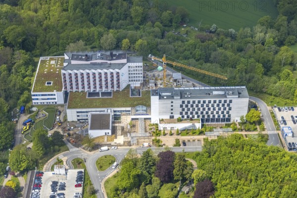 Aerial view, Ruhrlandklinik with construction site, Essen-Heidhausen, Essen, Ruhr area, North Rhine-Westphalia, Germany, construction work, construction area, construction site, building plots, construction crane, construction measure, construction project, construction site, DE, Europe, specialist clinic, healthcare, hospital, clinic, clinic centre, hospital, aerial photograph, aerial photography, aerial photography, medical facility, medical aid, new building, emergency service, Tüschener Weg, overview, bird's eye view, birds-eyes view, overview, medical care