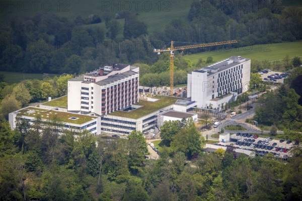 Aerial view, Ruhrlandklinik with construction site, Essen-Heidhausen, Essen, Ruhr area, North Rhine-Westphalia, Germany, construction work, construction area, construction site, building plots, construction crane, construction measure, construction project, construction site, DE, Europe, specialist clinic, healthcare, hospital, clinic, clinic centre, hospital, aerial photograph, aerial photography, aerial photography, medical facility, medical aid, new building, emergency service, Tüschener Weg, overview, bird's eye view, birds-eyes view, overview, medical care
