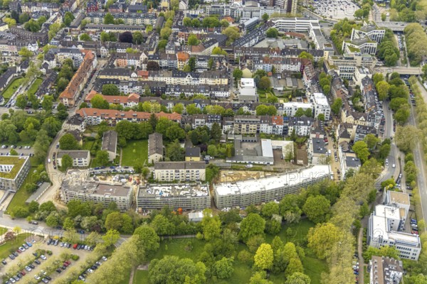 Aerial view, RüBogen construction site and new construction residential buildings in Gummertstraße, Essen-Rüttenscheid, Essen, Ruhr area, North Rhine-Westphalia, Germany, construction work, construction area, construction site, building plots, construction crane, construction measure, construction project, construction site, DE, Europe, property tax, Herthastraße, real estate, capacity requirements, aerial view, aerial photography, aerial photography, new construction, overview, bird's eye view, residential complex, Wohnbau eG, residential area, residential buildings, birds-eyes view, overview