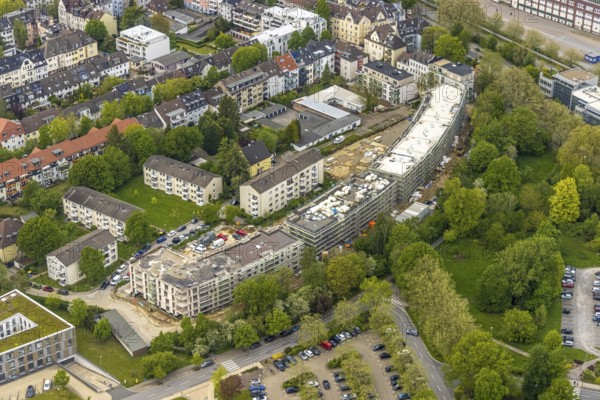 Aerial view, RüBogen construction site and new construction residential buildings in Gummertstraße, Essen-Rüttenscheid, Essen, Ruhr area, North Rhine-Westphalia, Germany, construction work, construction area, construction site, building plots, construction crane, construction measure, construction project, construction site, DE, Europe, property tax, Herthastraße, real estate, capacity requirements, aerial view, aerial photography, aerial photography, new construction, overview, bird's eye view, residential complex, Wohnbau eG, residential area, residential buildings, birds-eyes view, overview