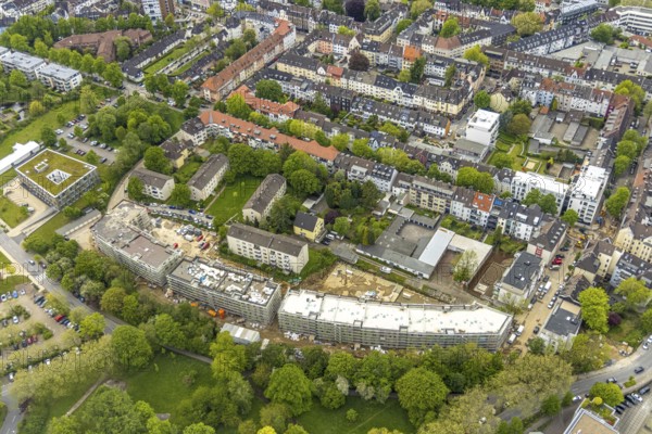 Aerial view, RüBogen construction site and new construction residential buildings in Gummertstraße, Essen-Rüttenscheid, Essen, Ruhr area, North Rhine-Westphalia, Germany, construction work, construction area, construction site, building plots, construction crane, construction measure, construction project, construction site, DE, Europe, property tax, Herthastraße, real estate, capacity requirements, aerial view, aerial photography, aerial photography, new construction, overview, bird's eye view, residential complex, Wohnbau eG, residential area, residential buildings, birds-eyes view, overview