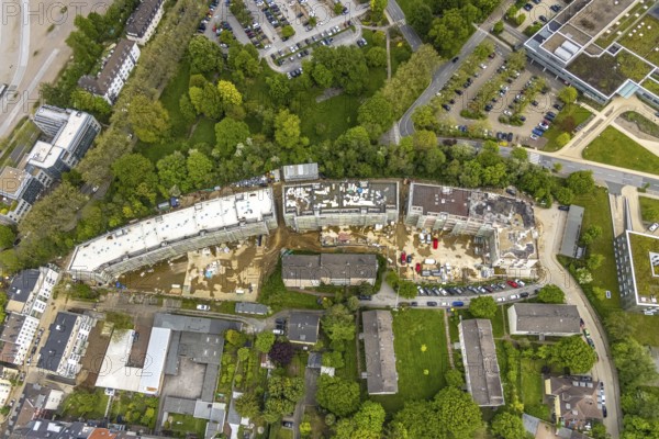 Aerial view, RüBogen construction site and new construction residential buildings in Gummertstraße, Essen-Rüttenscheid, Essen, Ruhr area, North Rhine-Westphalia, Germany, construction work, construction area, construction site, building plots, construction crane, construction measure, construction project, construction site, DE, Europe, property tax, Herthastraße, real estate, capacity requirements, aerial view, aerial photography, aerial photography, new construction, overview, bird's eye view, residential complex, Wohnbau eG, residential area, residential buildings, birds-eyes view, overview