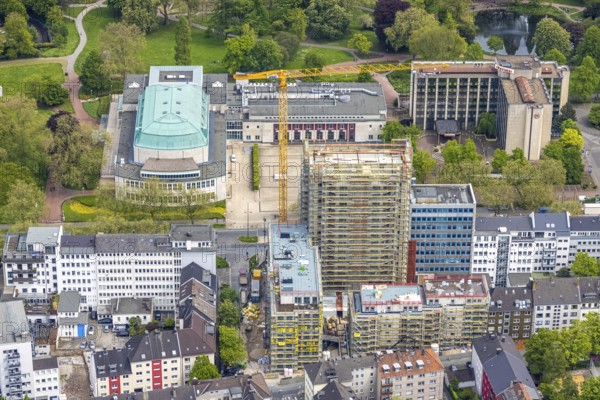 Aerial view, Philharmonie Essen on Huyssenallee, construction site, new building complex with residential tower and senior citizens' flats Huyssenallee, Essen, Ruhr area, North Rhine-Westphalia, Germany, construction work, construction, construction area, construction site, construction crane, construction measure, construction project, construction site, care and nursing, DE, renewal, development, Europe, catering, hotel, hotel facilities, hotel industry, capacity requirements, concert hall, culture, art, aerial photography, aerial photography, aerial photography, new building, care facility, retirement home, retirement centre, Sheraton Essen Hotel, overview, events, venue, event location, event centre, bird's eye view, birds-eyes view, cultural use, overview