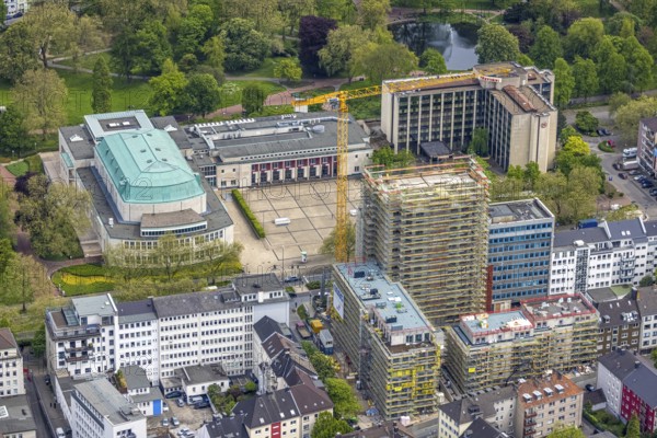 Aerial view, Philharmonie Essen on Huyssenallee, construction site, new building complex with residential tower and senior citizens' flats Huyssenallee, Essen, Ruhr area, North Rhine-Westphalia, Germany, construction work, construction, construction area, construction site, construction crane, construction measure, construction project, construction site, care and nursing, DE, renewal, development, Europe, catering, hotel, hotel facilities, hotel industry, capacity requirements, concert hall, culture, art, aerial photography, aerial photography, aerial photography, new building, care facility, retirement home, retirement centre, Sheraton Essen Hotel, overview, events, venue, event location, event centre, bird's eye view, birds-eyes view, cultural use, overview