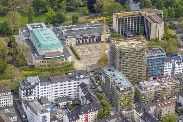 Aerial view, Philharmonie Essen on Huyssenallee, construction site, new building complex with residential tower and senior citizens' flats Huyssenallee, Essen, Ruhr area, North Rhine-Westphalia, Germany, construction work, construction, construction area, construction site, construction crane, construction measure, construction project, construction site, care and nursing, DE, renewal, development, Europe, catering, hotel, hotel facilities, hotel industry, capacity requirements, concert hall, culture, art, aerial photography, aerial photography, aerial photography, new building, care facility, retirement home, retirement centre, Sheraton Essen Hotel, overview, events, venue, event location, event centre, bird's eye view, birds-eyes view, cultural use, overview