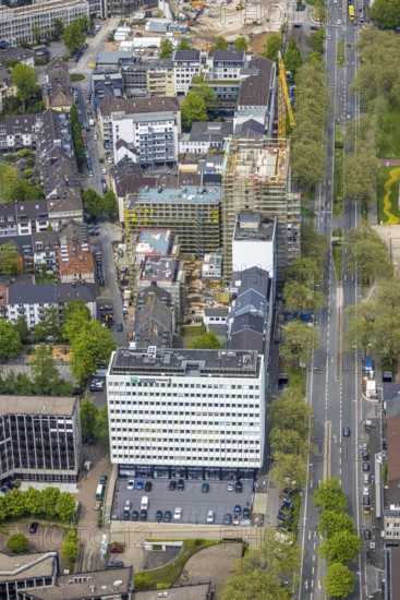 Aerial view, construction site, new building complex with residential tower and senior citizens' flats Huyssenallee, Essen, Ruhr area, North Rhine-Westphalia, Germany, construction work, construction, construction area, construction site, construction crane, construction measure, construction project, construction site, care and nursing, DE, renewal, development, Europe, capacity requirements, concert hall, aerial view, aerial photography, aerial photography, new building, care facility, retirement home, retirement centre, Sheraton Essen Hotel, overview, bird's-eye view, birds-eyes view, overview