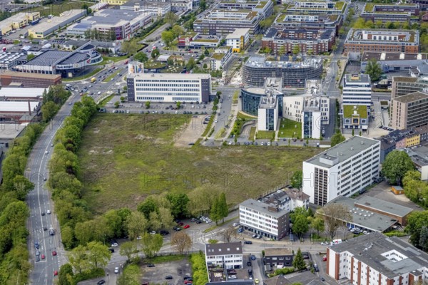Aerial view, brownfield Schwanenkampstraße, construction site and new office building at the corner of Frohnhauser Straße and Kurt-Jooss-Straße, City, Westviertel, Essen, Ruhr area, North Rhine-Westphalia, Germany, construction work, construction area, construction site, building plots, construction project, construction site, DE, Europe, city centre, aerial view, aerial photography, aerial photography, new building, city centre, overview, bird's eye view, overview